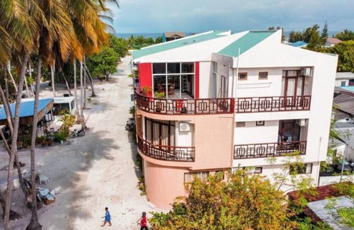 Huraa House | Seaview Suite in Huraa Guesthouse with AC, Wifi & Balcony