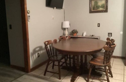 Onekama Apartment | Relax on deck next to the pool in this two room suite.