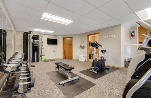 Four O'Clock Condo | Sunny ski-in condo with mountain views, hot tubs, pool, fireplace, firepit, & gym