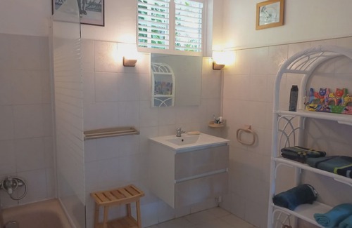 Les Abymes Apartment | Charming studio in a tropical garden. with swimming pool, free wifi and parking.
