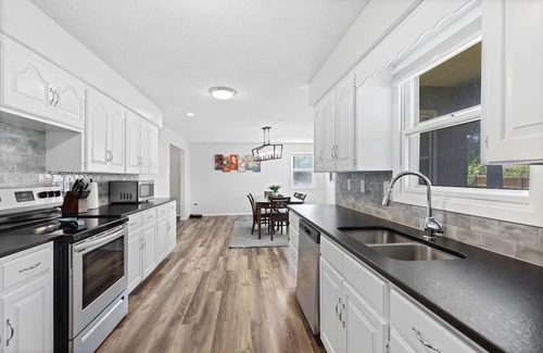 Joplin House | Stylish Rancher in Quiet, Tree Lined Neighborhood.